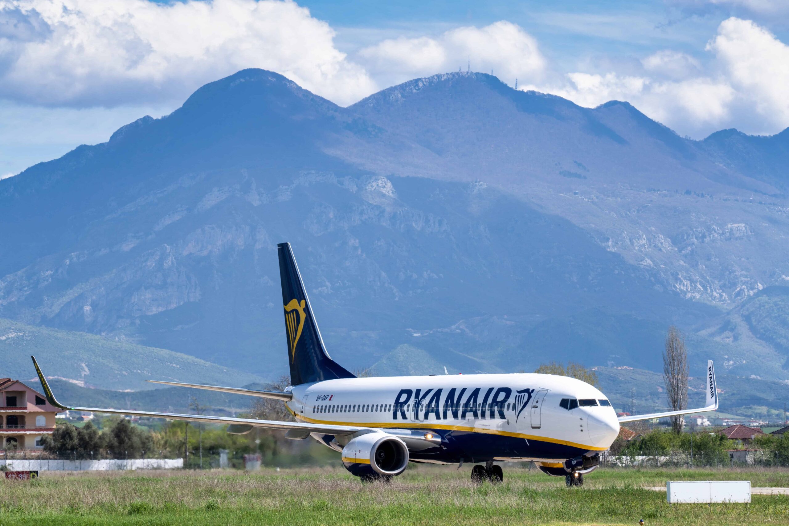 ryanair plane in front of mountain in background