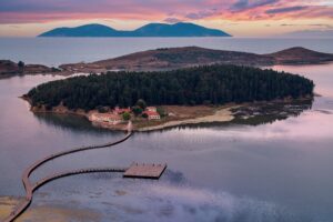 monastery on island with boardwalk leading to it